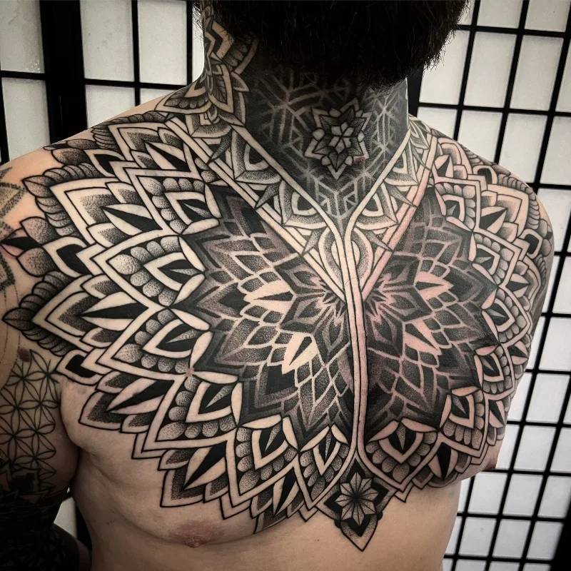 Chest Neck Ornamental Tattoo done by Jack Peppiette