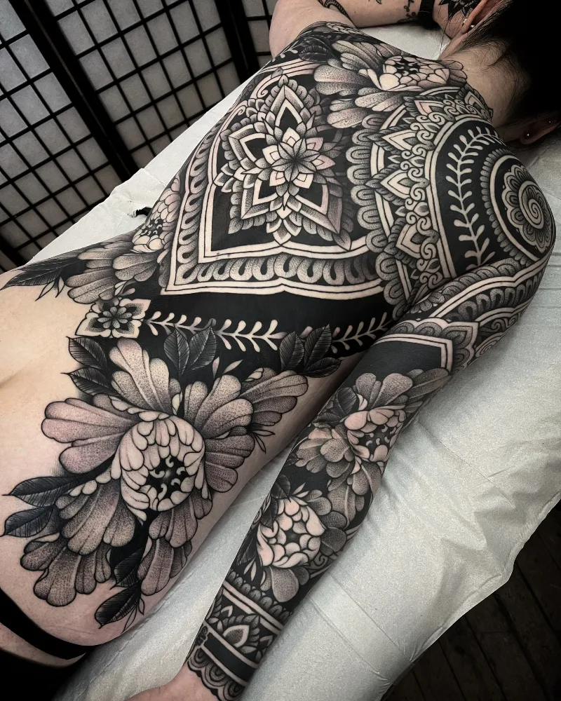 Full body ornamental black and grey flowers mandala tattoo done by Jack Peppiette