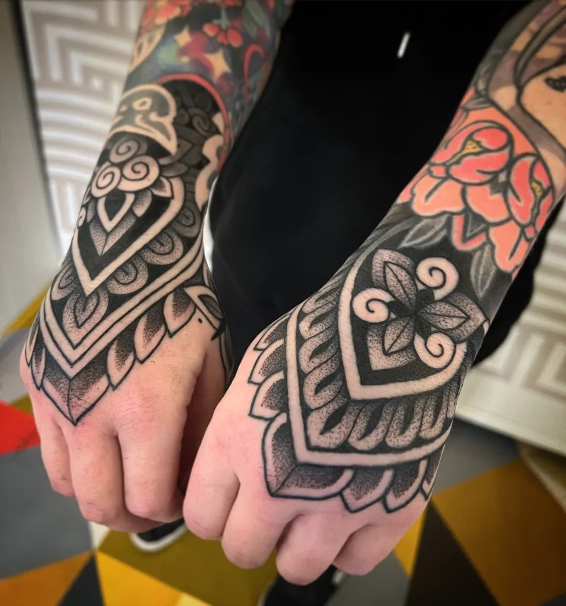 Ornamental hands tattoo done by Jack Peppiette